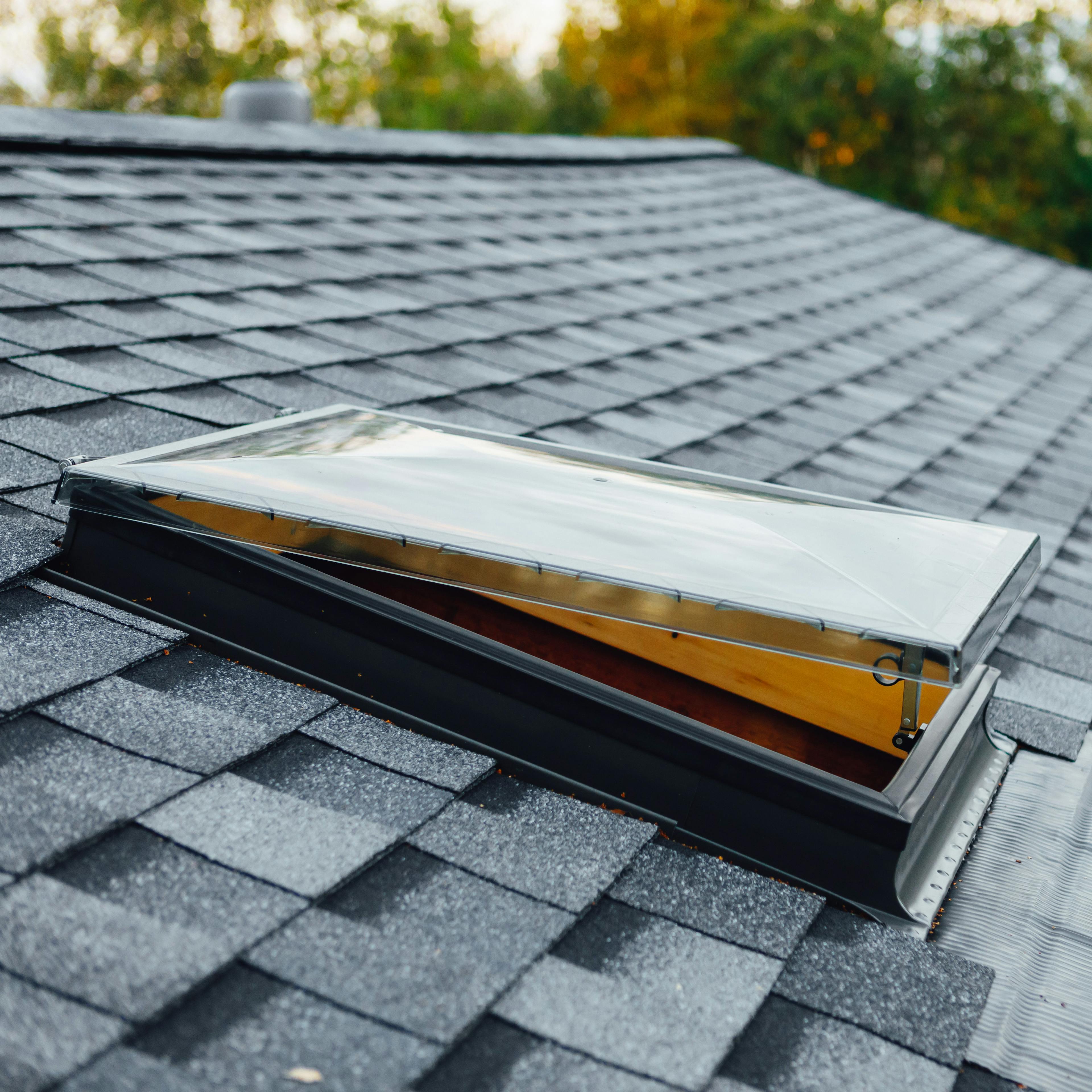 A beautiful asphalt roof with an open sunlight featured prominently