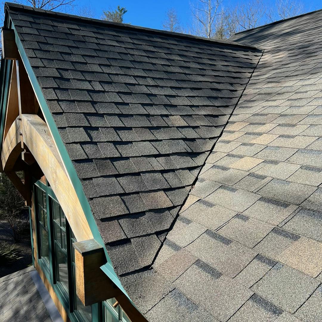 A shingled roof with gables